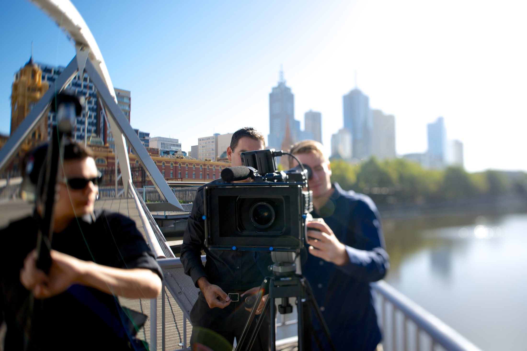 Professional camera crew filming beside the Yarra River in Melbourne